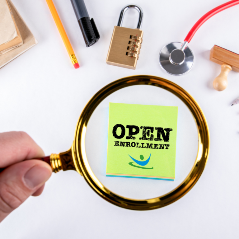 person holding a magnifying glass over a sticky note that says "OPEN ENROLLMENT"